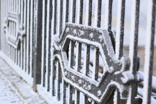 snow-covered bridge fence