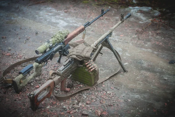 Machine gun and  sniper rifle on military firing