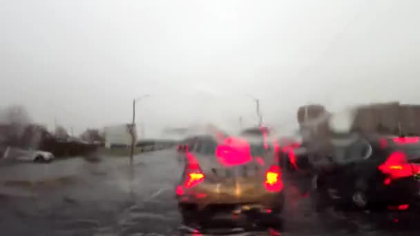 Car Waiting Traffic While Raining Windshield Vehicle Idling City Street — Stock Video