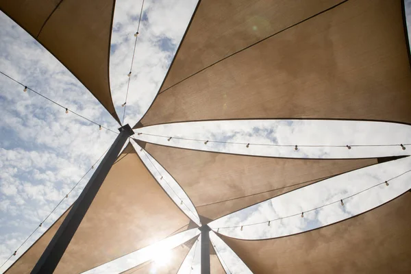 Canvas Tent with recorative light bulb on the cloudy day