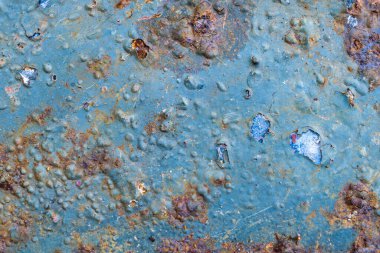 rusting old metal plate painted with blue paint clipart