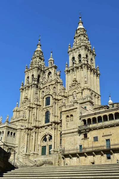 Cathedral: Side view from stairs. Santiago de Compostela, Obradoiro Square. Spain. Sunny day, clean stone, blue sky.