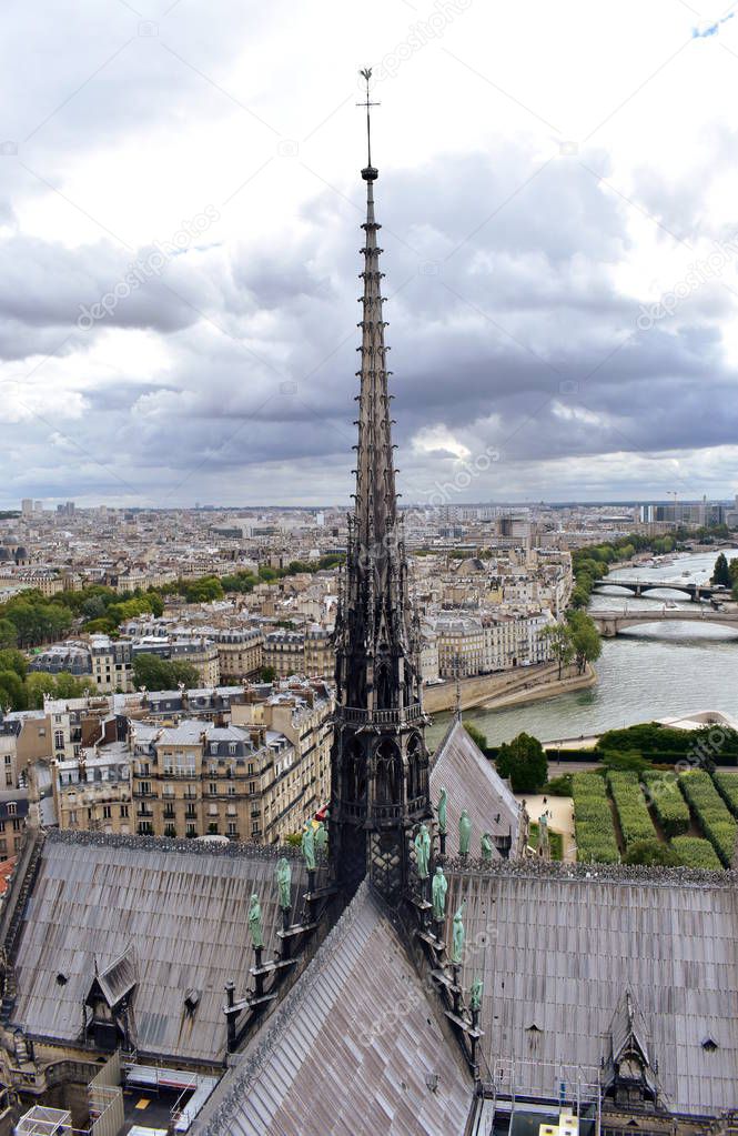 Notre Dame Spire, La Fleche, and lead clad wooden roofs before the fire. Cityscape with the Seine River and bridges. Paris, France.