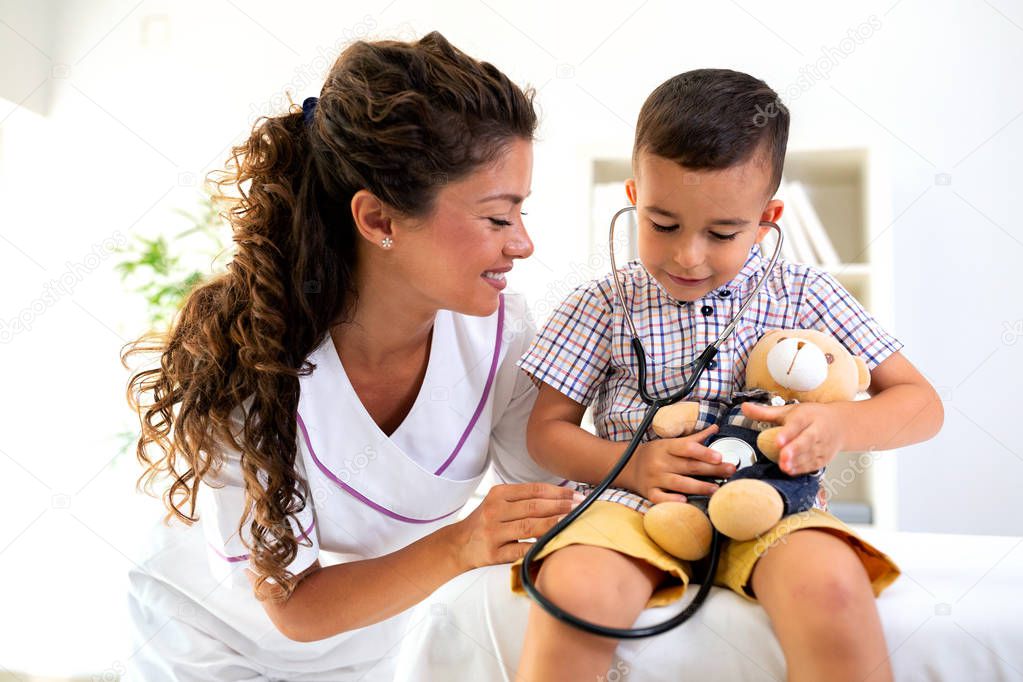 Teddy bear being checked for a heartbeat with stethoscope