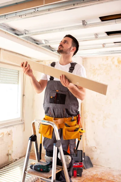 Using a properly measured ceiling plank emphasizes neatness in a job well done