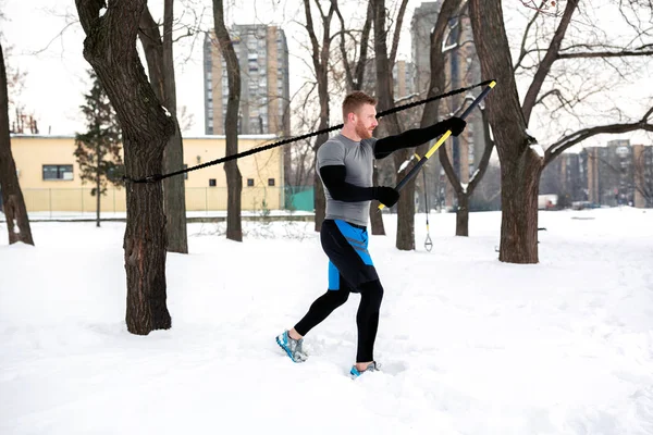 Working out with suspension strap rod benefits muscle endurance and toughness