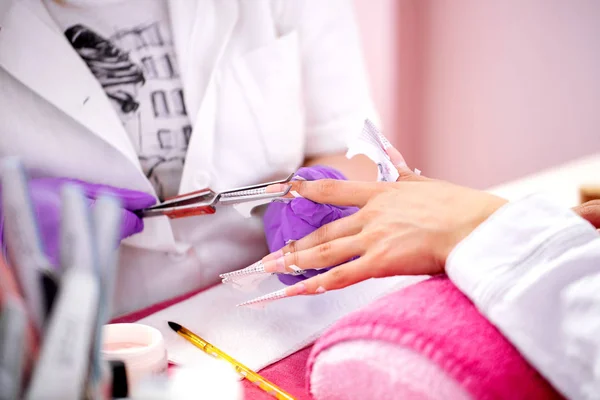 Artificial nail enhancements manicure process
