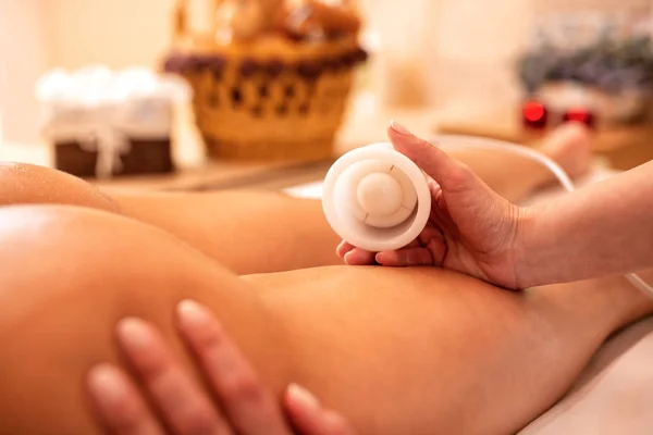 Anti-cellulite treatment with one vacuum cup — Stock Photo, Image
