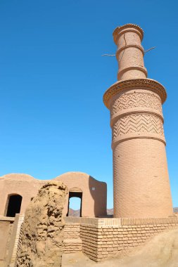 Kharanagh Ardakan Castle, an ancient village with a minaret near the desert city of Yazd in Iran clipart