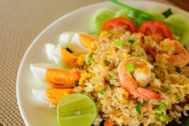 Fried rice with shrimp and salted eggs slice on a plate. Thai local food