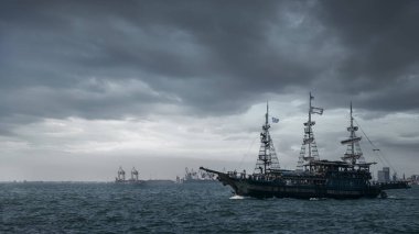 Pirate ship coming out of modern city