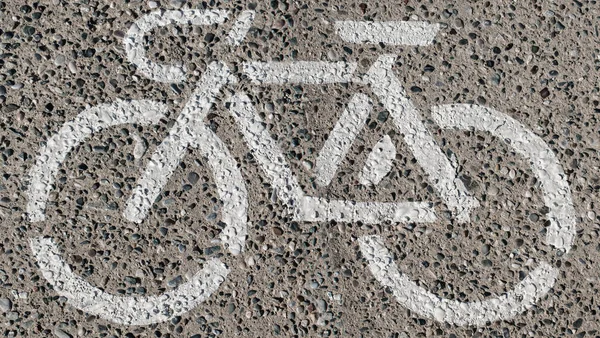 Fietsstempel logo geschilderd op de grond — Stockfoto