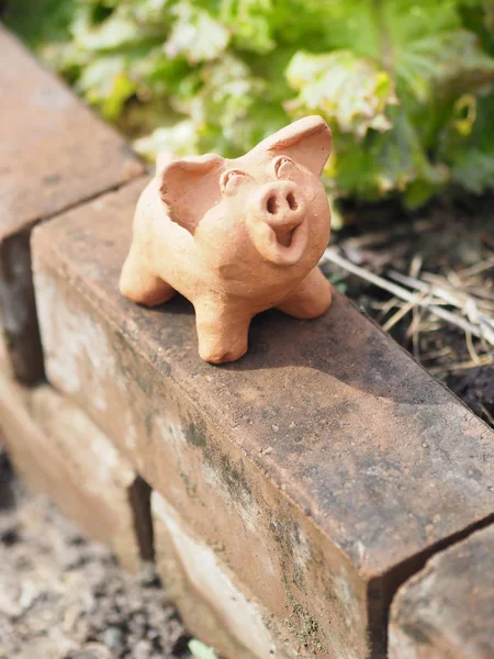 Pig Terracotta on the brick pottery earthenware crockery ceramic space for write background