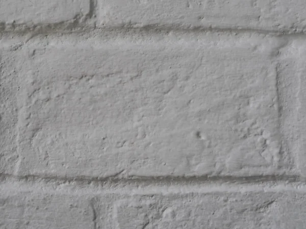 レンガの壁はパターンスタックブロックラフサーフェステクスチャ材料の背景セメントグラウトホワイトカラー塗料で関節を溶接を示しています — ストック写真