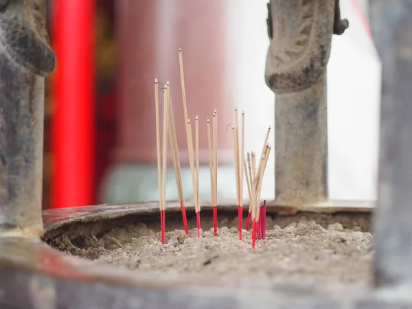 incense burner incense stick in a pot on the spot, joss sticks with smoke for praying in Buddhism temple