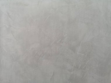 Beton duvardaki çatlaklar gri renge ve pürüzsüz soyut yüzey dokusuna, beton malzeme arka planına sahiptir.
