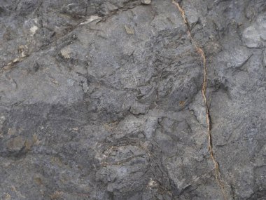 Koyu gri renkli taş arka plan, siyah sert kaya yapısı