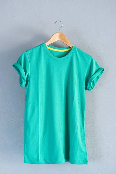 Retro fold green cotton T-Shirt clothes mock up template on gray