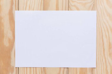 Soyut boş bir beyaz kağıt üzerinde ahşap masa üst görünüm backgrou