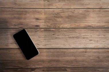 Vintage telefon mockup düz eski masa üst eski ahşap backgrou üzerinde yatıyordu