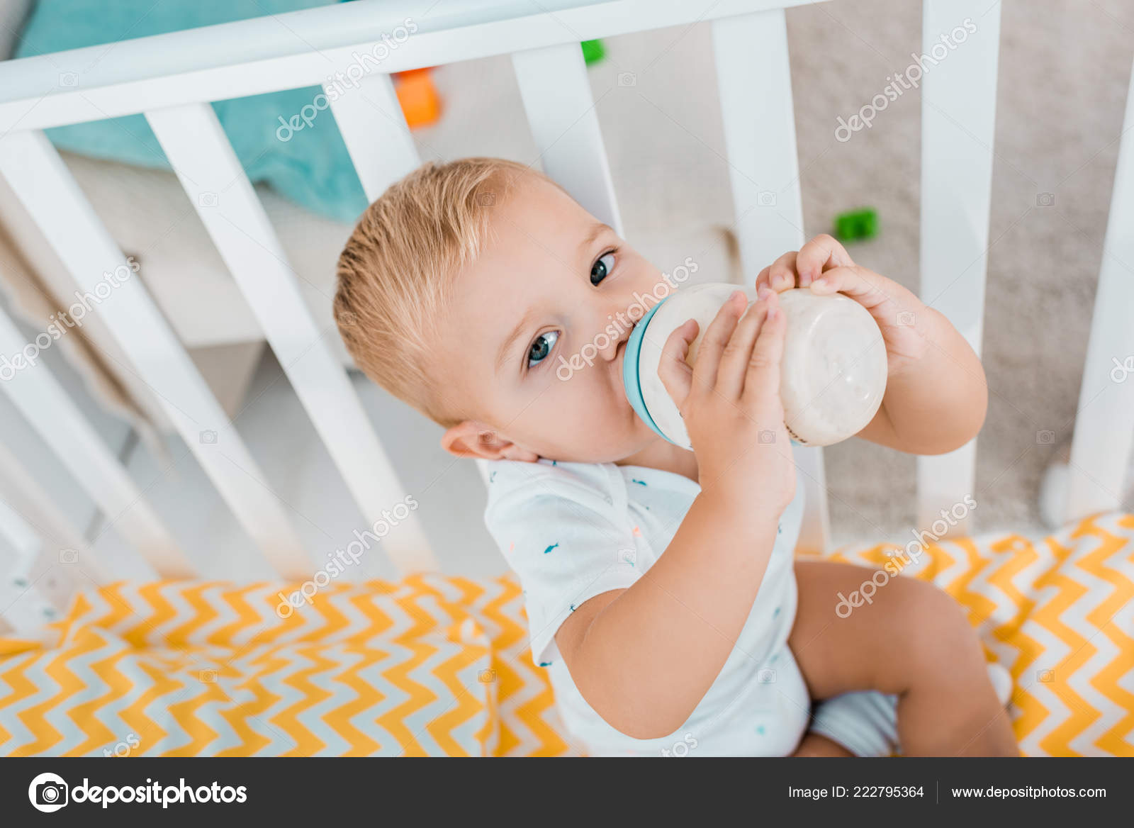 Adorable Toddler Drinking Out Baby Bottle Crib Stock Photo by ©HayDmitriy  222795364