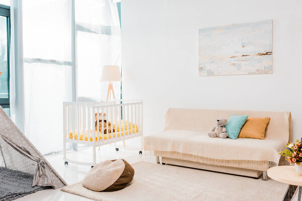 modern interior design of nursing room with crib