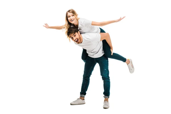 Cheerful Young Couple Piggybacking Smiling Camera Isolated White — Stock Photo, Image