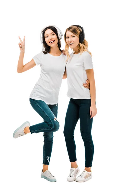 Beautiful Happy Girls Headphones Standing Together Showing Victory Sign Isolated — Stock Photo, Image