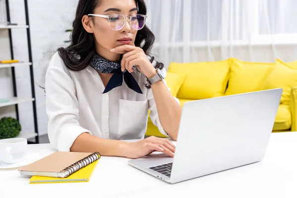 Beautiful Thoughtful Asian Freelancer Using Laptop Holding Hand Chin — Stock Photo, Image