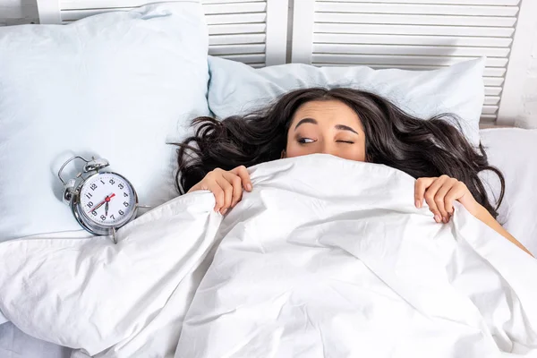 Young Beautiful Asian Woman Looking Alarm Clock Blanket Squinting One — Stock Photo, Image