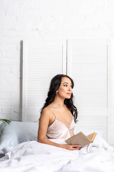 Pretty Asian Woman Elegant Nightie Sitting Bed Holding Book — Stock Photo, Image