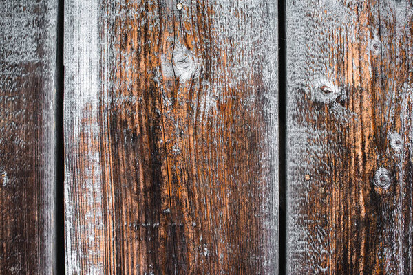 close up of textured brown frosty wooden planks 