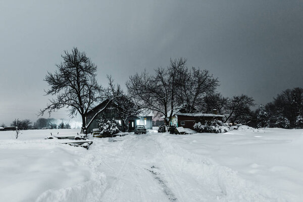 wooden houses in Carpathian Mountains in winter at night