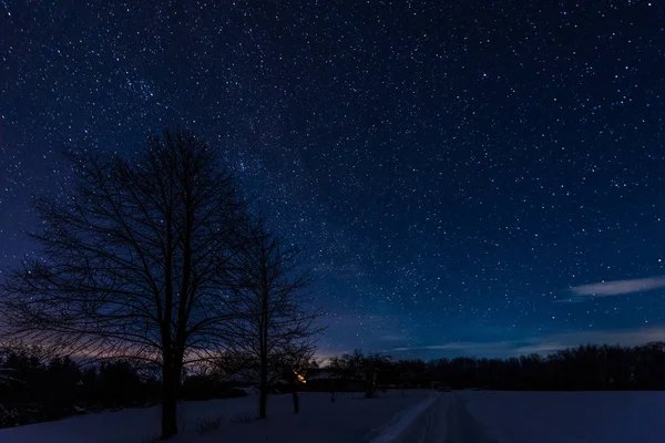 dark sky full of shiny stars in carpathian mountains in winter at night
