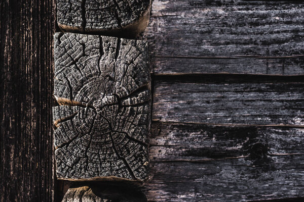 dark brown weathered textured wooden logs