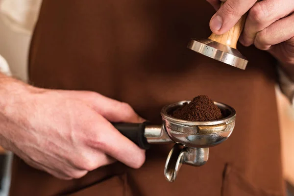Cropped View Barista Brown Apron Holding Portafilter Ground Coffee Tamper — Stock Photo, Image