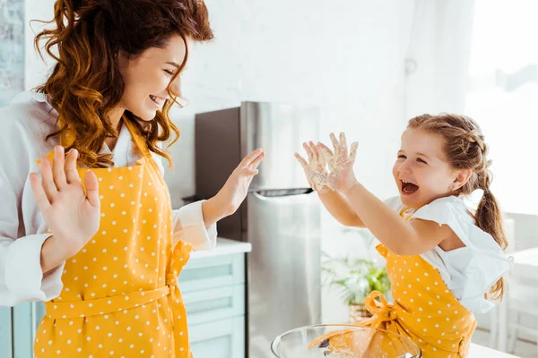 Excited Daughter Showing Mother Hands Dough — Stock Photo, Image