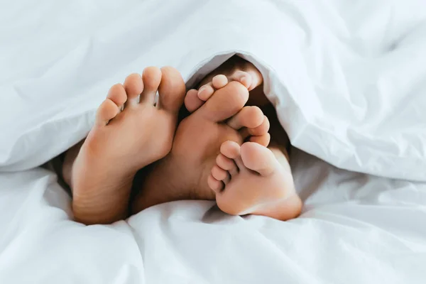 Cropped View Girlfriend Boyfriend Barefoot Lying Bed — Stock Photo, Image