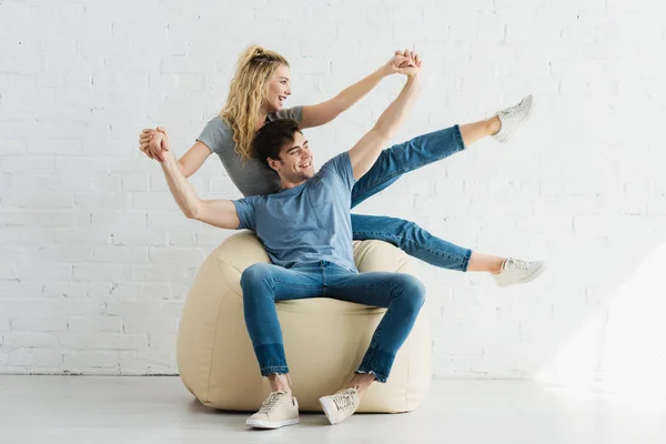 Cheerful Blonde Girl Happy Man Holding Hands While Sitting Bean — Stock Photo, Image