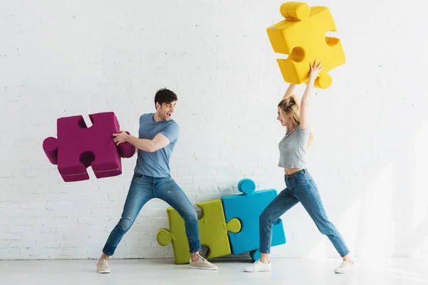 Cheerful Woman Happy Man Fighting Puzzle Pieces Home — Stock Photo, Image