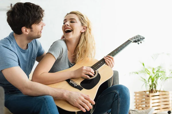 Happy Blonde Young Woman Holding Acoustic Guitar Cheerful Man — Stock Photo, Image