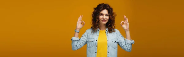 Panoramic Shot Cheerful Curly Redhead Woman Standing Showing Signs Orange — Stock Photo, Image