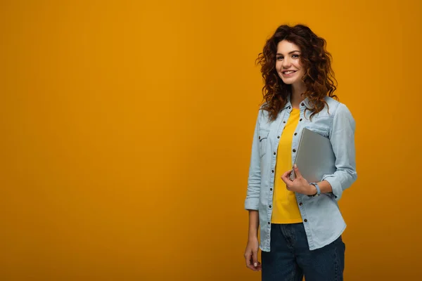 Cheerful Redhead Girl Holding Laptop Smiling Orange — Stock Photo, Image