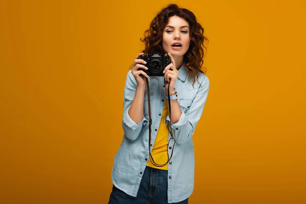 Attractive Redhead Photographer Holding Digital Camera Orange — Stock Photo, Image