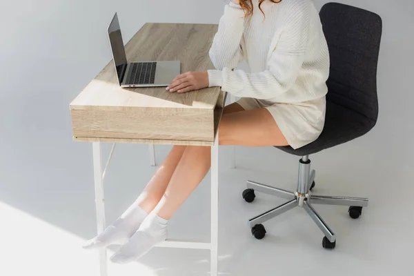 Cropped View Young Woman Sitting Laptop Grey — Stock Photo, Image