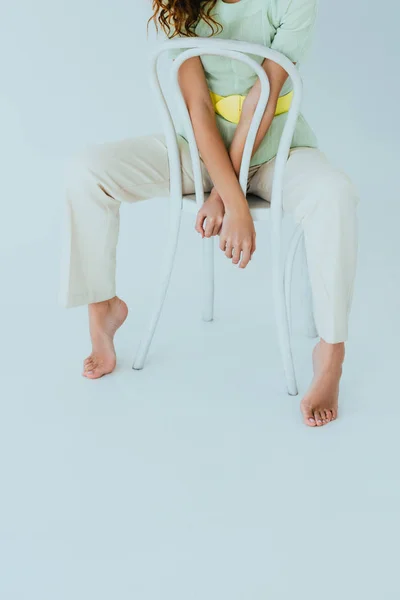 Cropped View Young Woman Barefoot Sitting Chair Grey — Stock Photo, Image