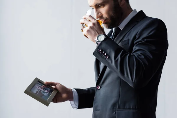 Upset Man Suit Drinking Whiskey Looking Photo Frame — Stock Photo, Image