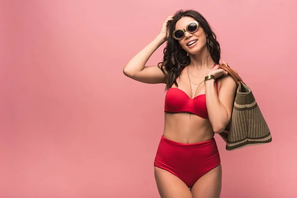 Smiling Attractive Woman Swimsuit Sunglasses Holding Beach Bag Isolated Pink — Stock Photo, Image