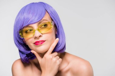 beautiful thoughtful girl in purple wig and sunglasses isolated on grey clipart