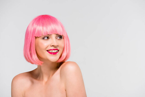 attractive smiling naked girl in pink wig isolated on grey